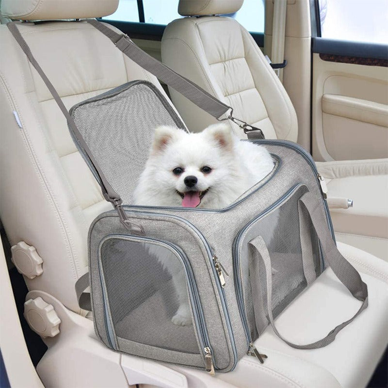Gray breathable foldable pet carrier backpack with fluffy white dog in car seat